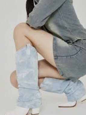 Slouchy denim fold-over cowboy boots featuring a light blue jean